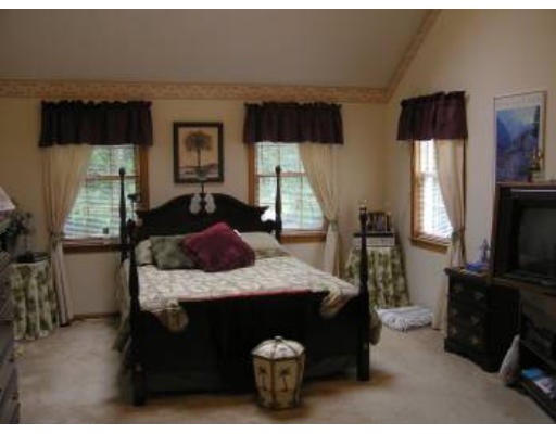16 Michigan Road Tyngsborough, MA 01879 - Photo 7 of 8 a bedroom with a bed and a flat tv screen on dresser
