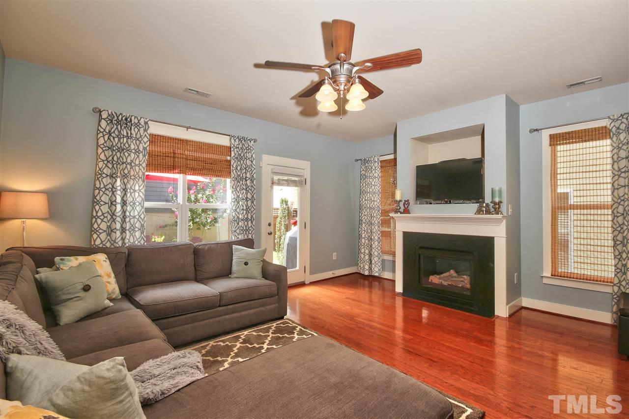 4522 All Points View Way Raleigh, NC 27614 - Photo 11 of 25 a living room with furniture a fireplace and a flat screen tv