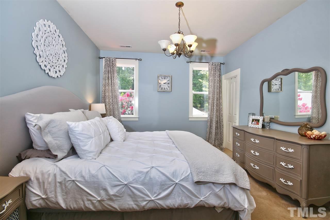 4522 All Points View Way Raleigh, NC 27614 - Photo 13 of 25 a bedroom with a bed and a dresser