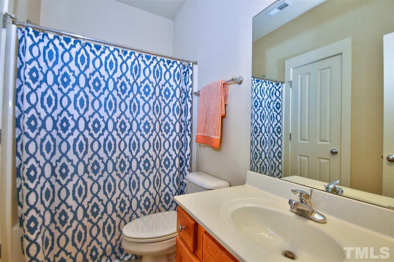 4522 All Points View Way Raleigh, NC 27614 - Photo 17 of 25 a bathroom with a sink and a mirror