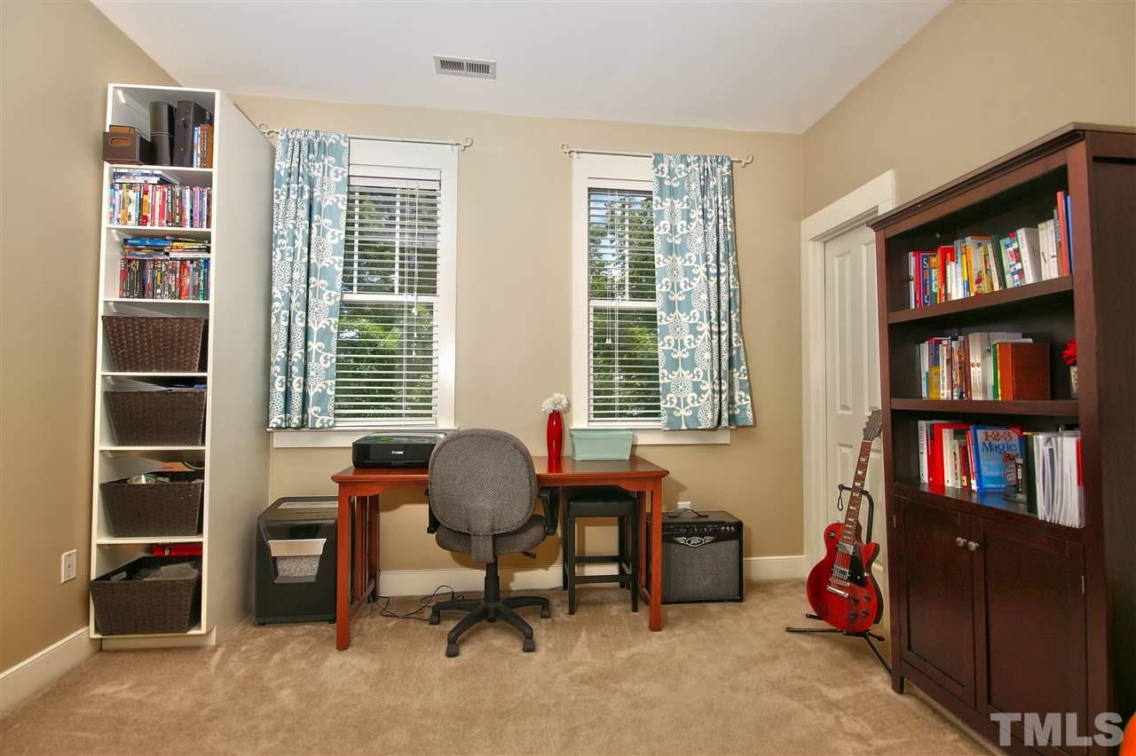 4522 All Points View Way Raleigh, NC 27614 - Photo 18 of 25 a view of a workspace with bookshelf and a window