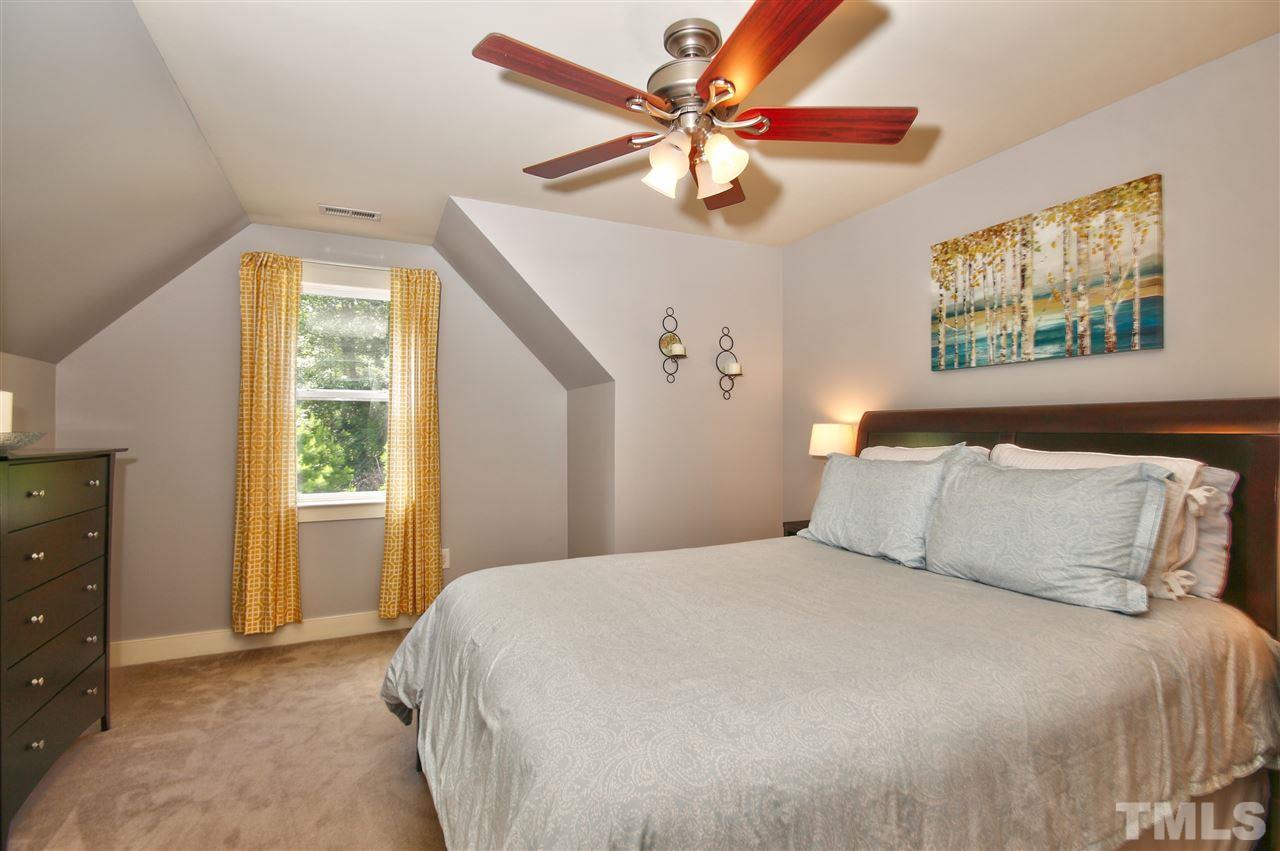 4522 All Points View Way Raleigh, NC 27614 - Photo 20 of 25 a bedroom with a large bed and a window