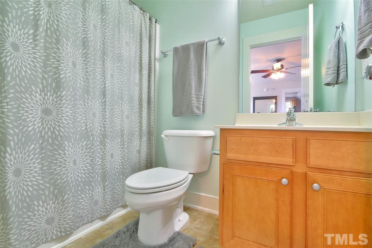 4522 All Points View Way Raleigh, NC 27614 - Photo 21 of 25 a bathroom with a sink a toilet and shower
