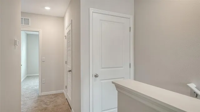 a living room with lots of furniture and a large window