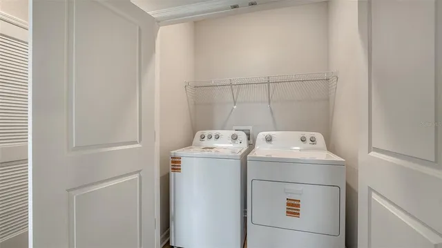 a living room with lots of furniture and a large window