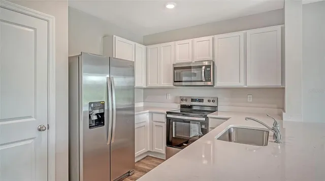 a view of a chairs and table in backyard
