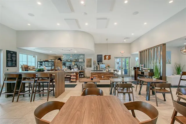 a kitchen with stainless steel appliances a sink a stove and refrigerator