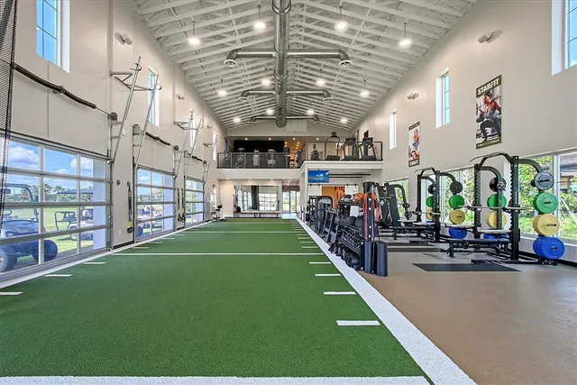 a front view of a house with swimming pool having outdoor seating
