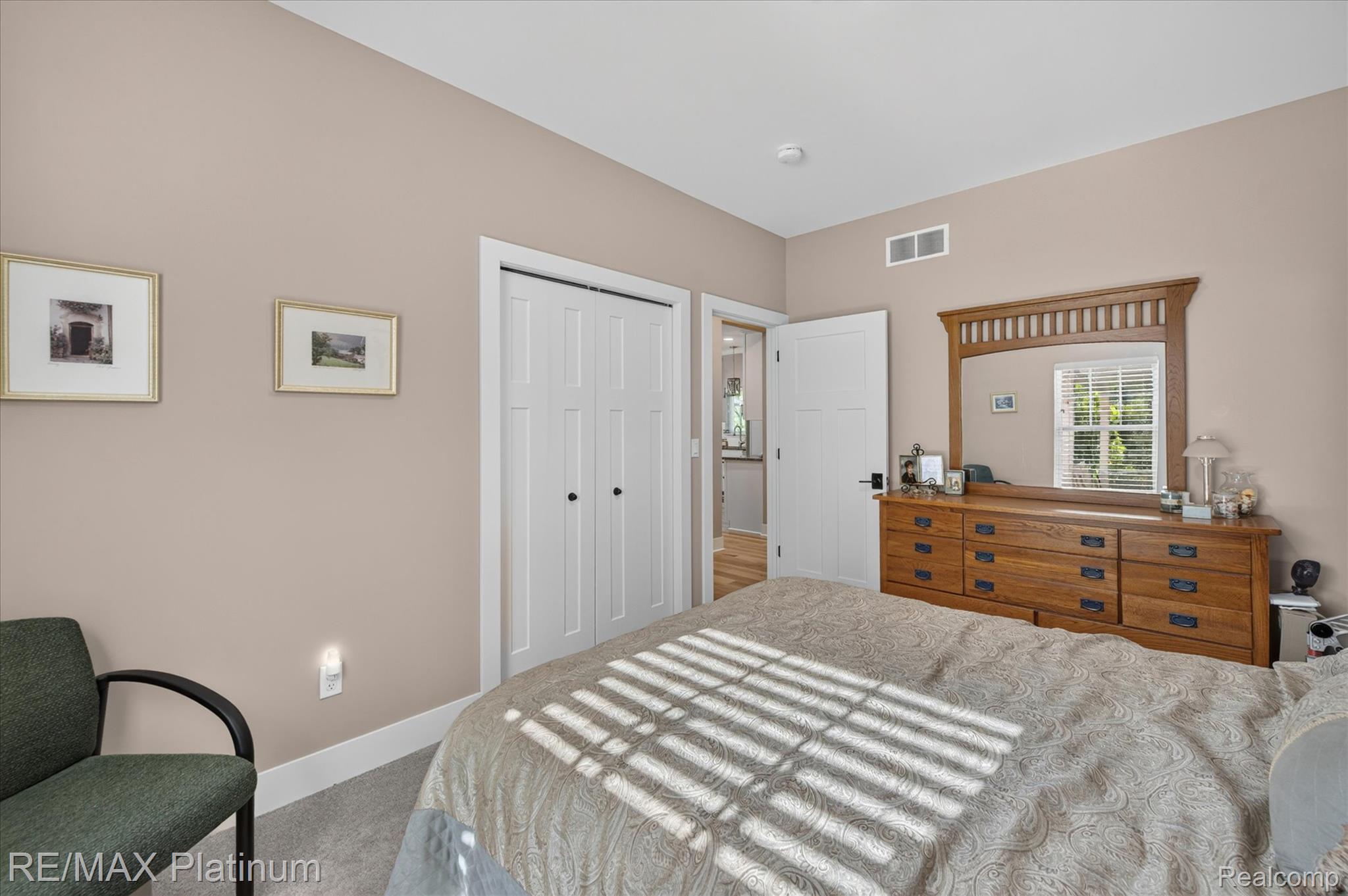 2676 Crooked Lake Road Howell, MI 48843 - Photo 33 of 60 Carpeted interior room featuring neutral wall paint, white trim, and a white bi-fold closet door