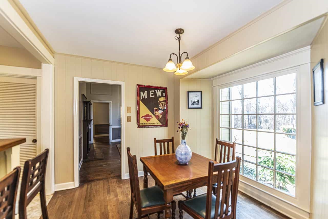 6746 Old Millington Road Millington, TN 38053 - Photo 12 of 40 Dining area featuring dark wood-style flooring and suspended lighting