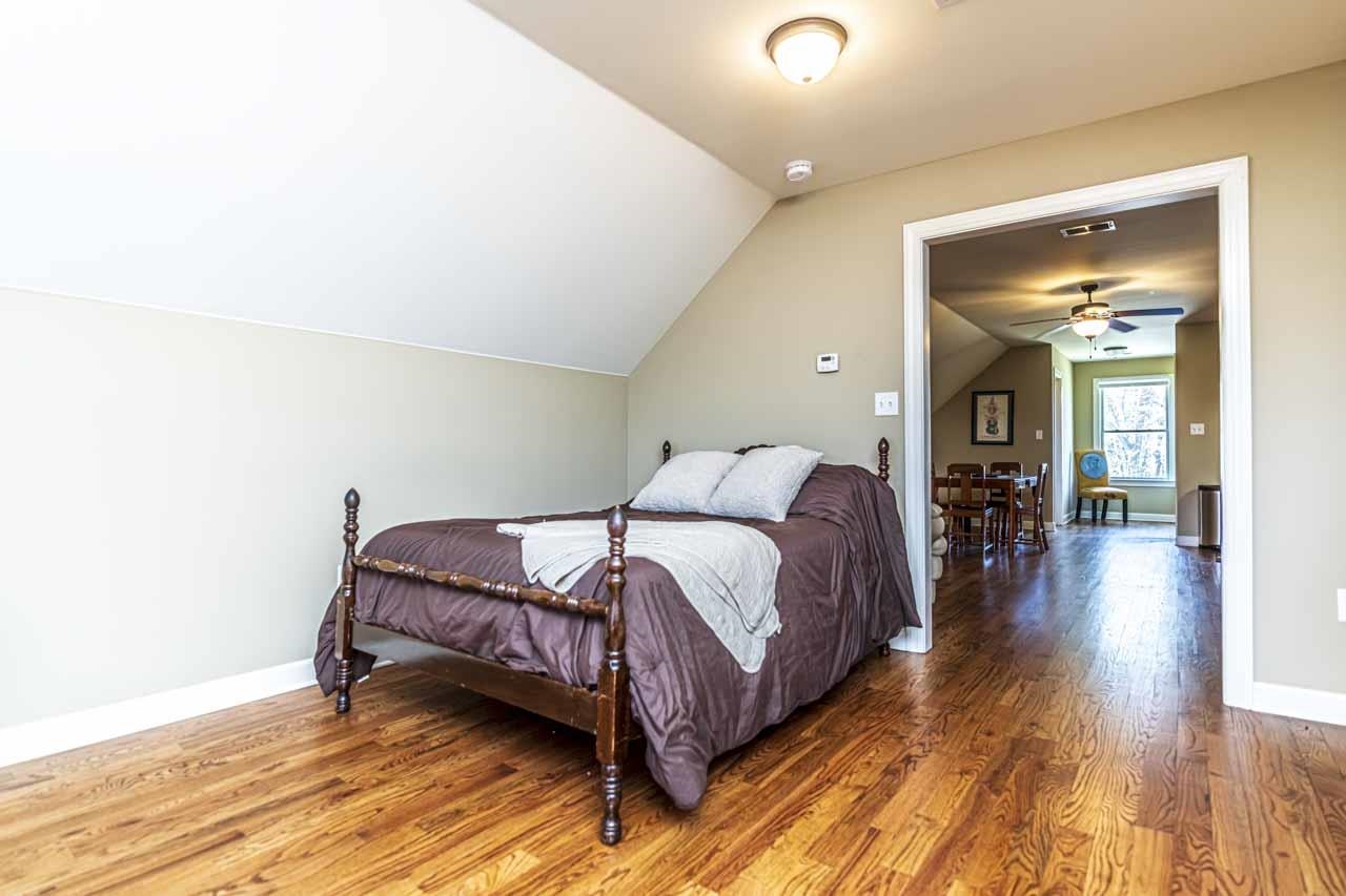 6746 Old Millington Road Millington, TN 38053 - Photo 25 of 40 Bedroom featuring vaulted ceiling and wood finished floors