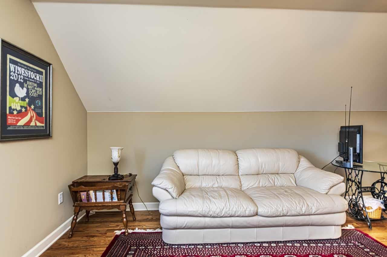 6746 Old Millington Road Millington, TN 38053 - Photo 27 of 40 Living area featuring lofted ceiling and wood finished floors