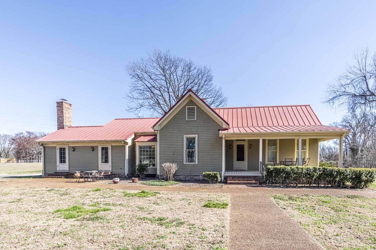 6746 Old Millington Road Millington, TN 38053 - Photo 5 of 40 a front view of a house with a yard