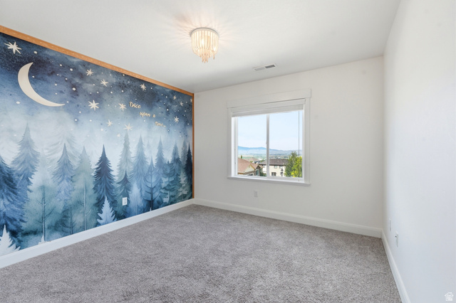 338 Windy Rdg Drive Smithfield, UT 84335 - Photo 27 of 63 Accent wall featuring a whimsical forest and night sky mural with wood trim