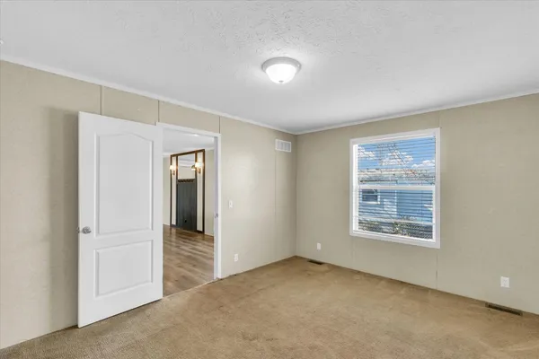 a view of an empty room with a window