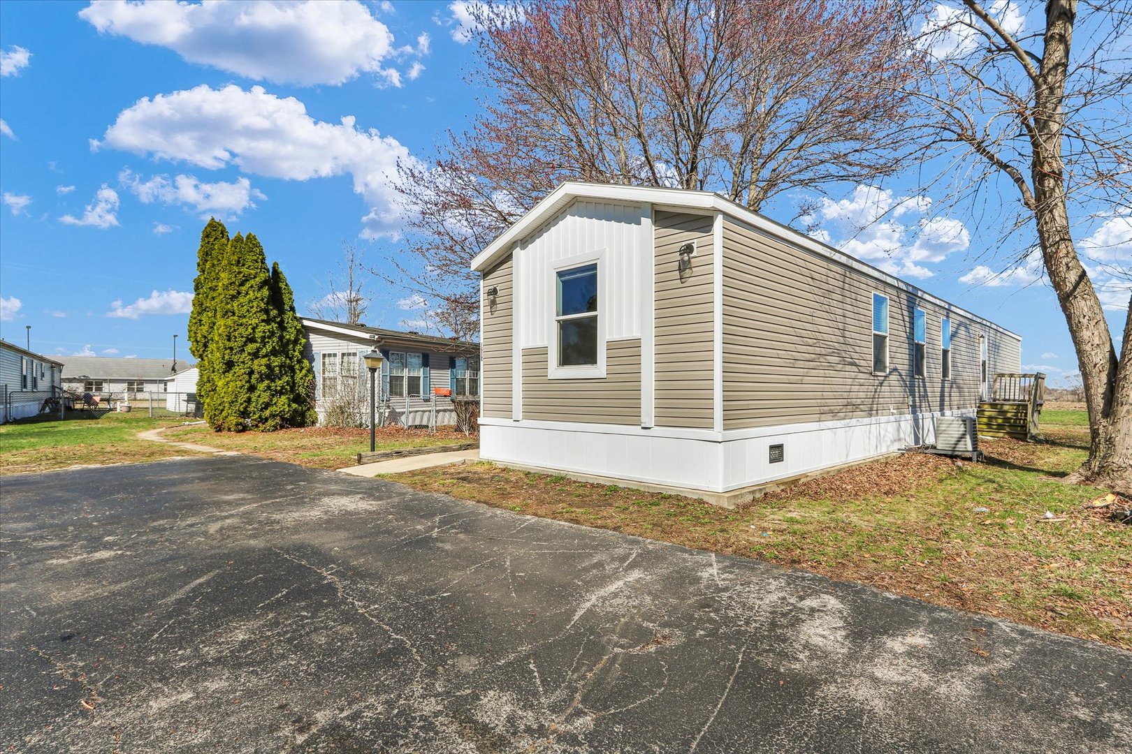 1205 Wedgewood Drive Rantoul, IL 61866 - Photo 8 of 31 a view of a house with a yard