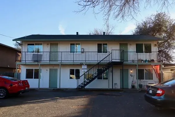 a view of a car park in front of house