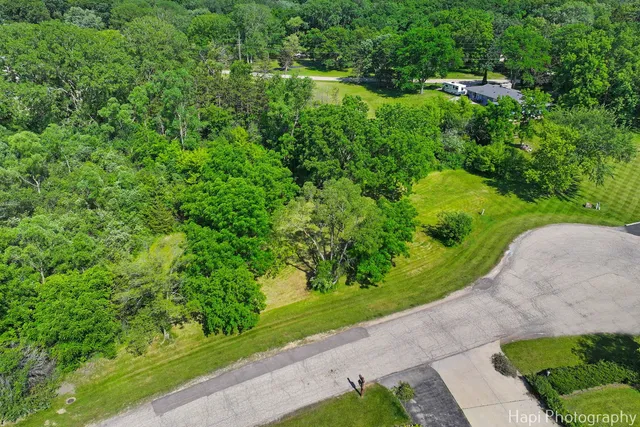 a view of a garden with a building