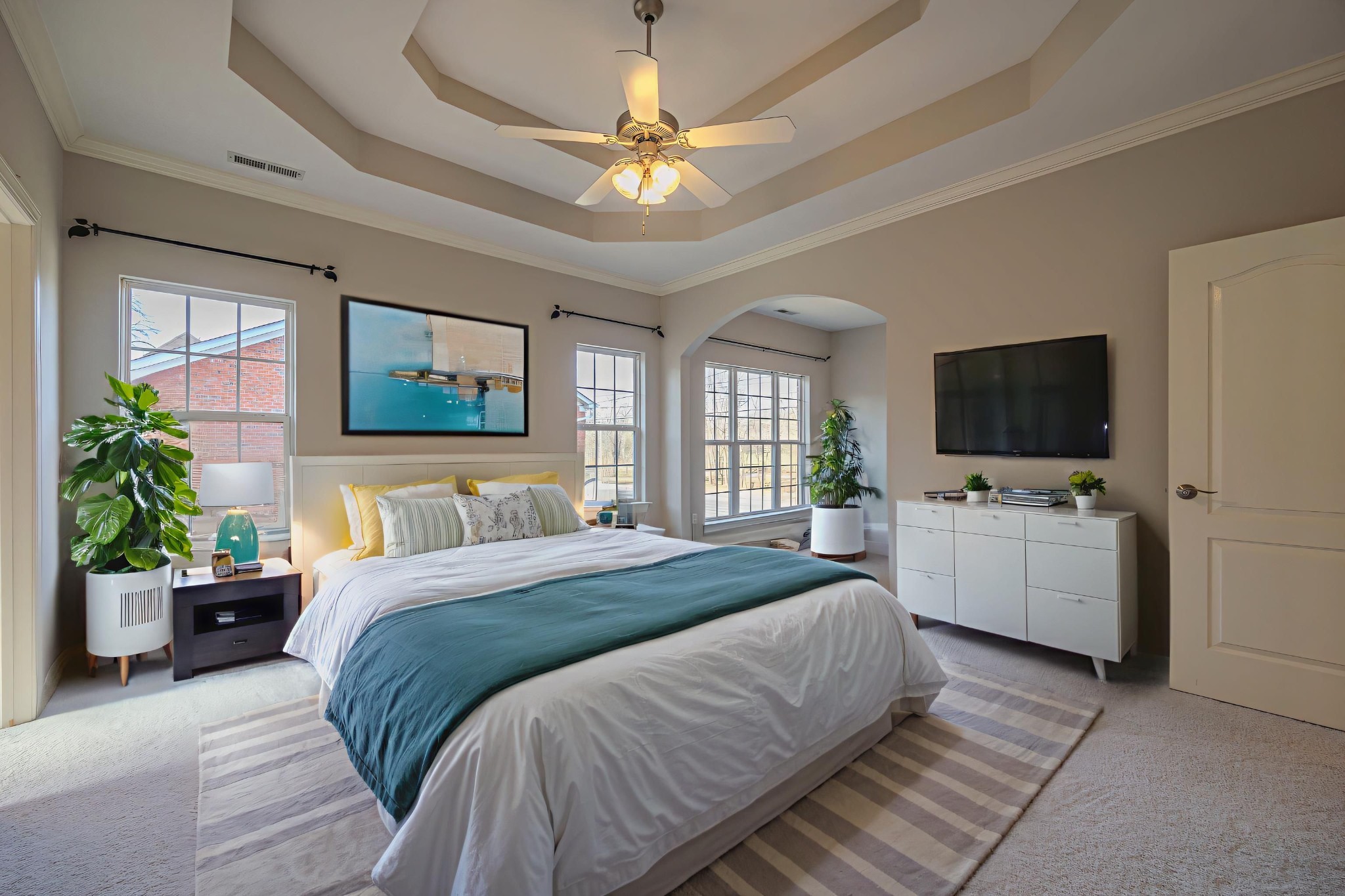 3545 Rock Springs Road Smyrna, TN 37167 - Photo 12 of 23 a bedroom with a large bed a flat tv screen and a chandelier