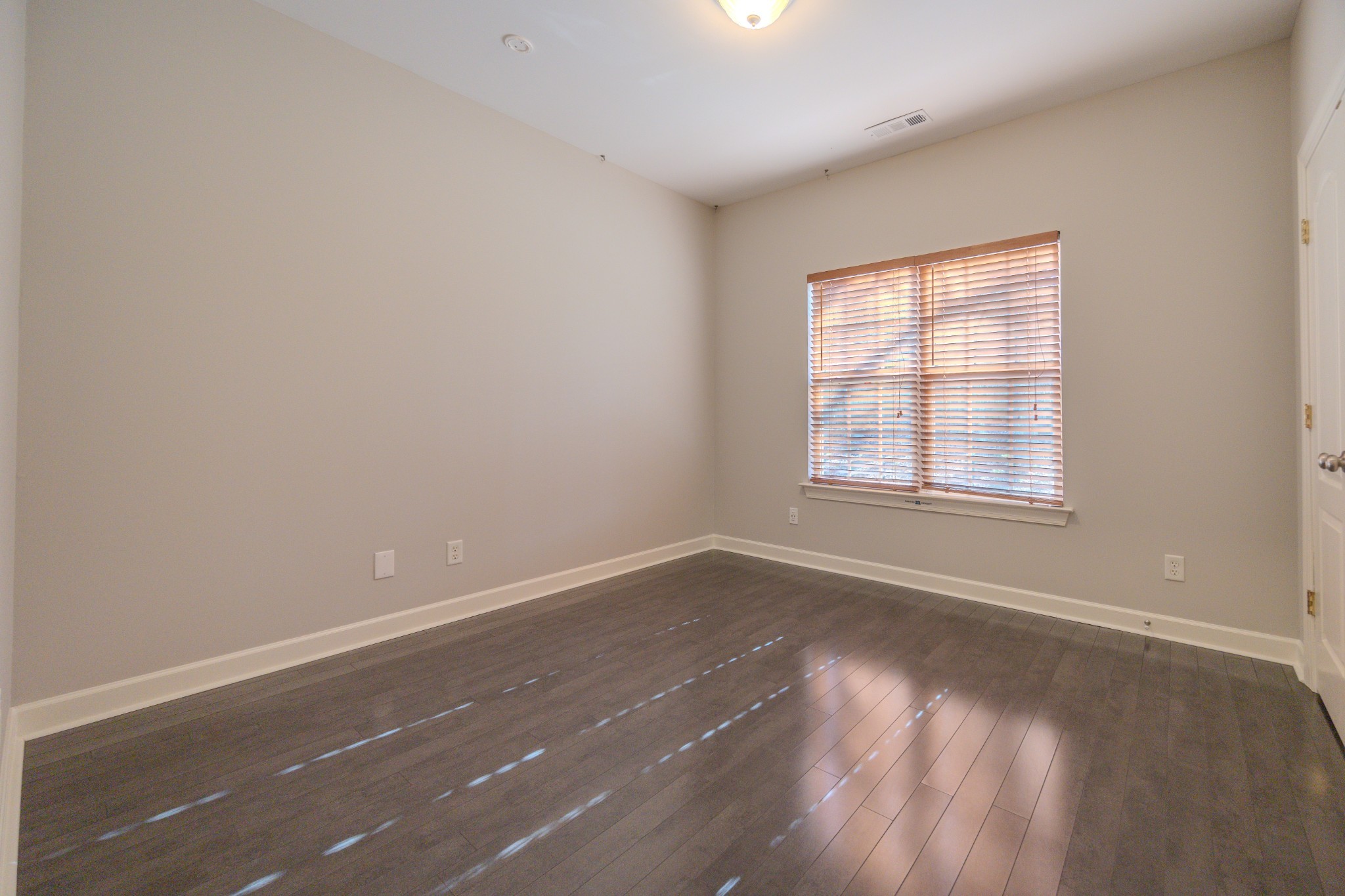 3545 Rock Springs Road Smyrna, TN 37167 - Photo 16 of 23 an empty room with wooden floor and windows