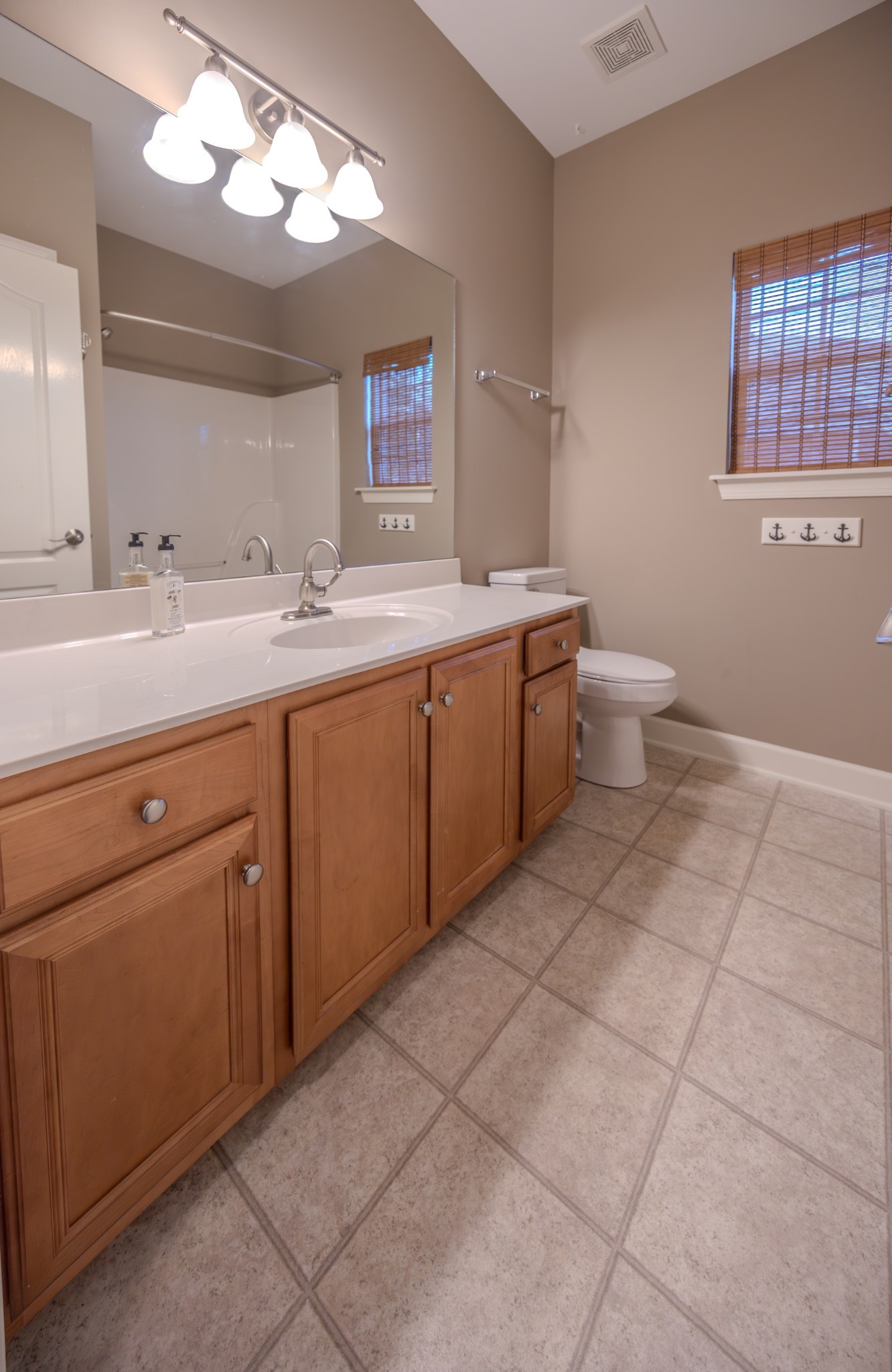 3545 Rock Springs Road Smyrna, TN 37167 - Photo 18 of 23 a spacious bathroom with a double vanity sink mirror and toilet