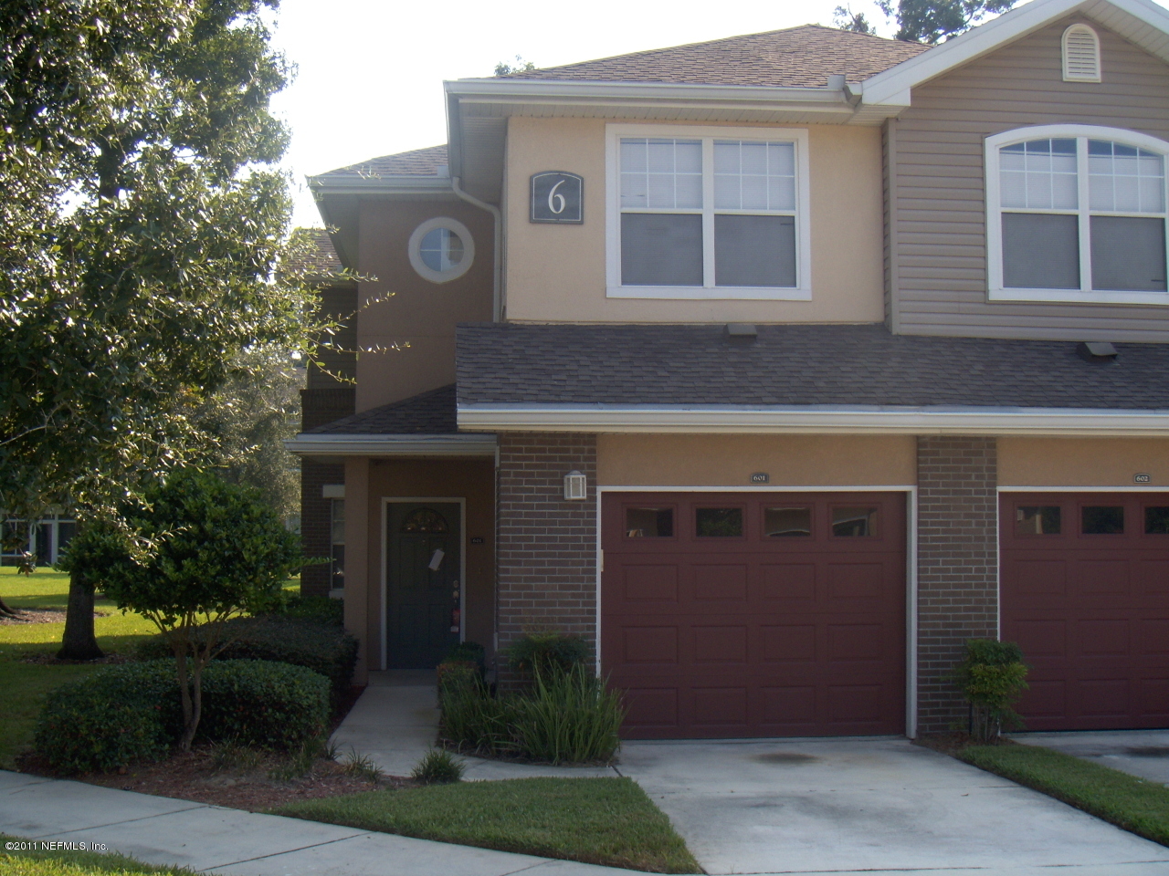 5663 Greenland Road, Unit 601 Jacksonville, FL 32258 - Photo 1 of 1 a front view of a house with garden