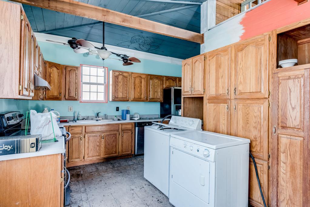 1099 Troutt Road Bethpage, TN 37022 - Photo 8 of 29 a kitchen with a stove a sink and a refrigerator