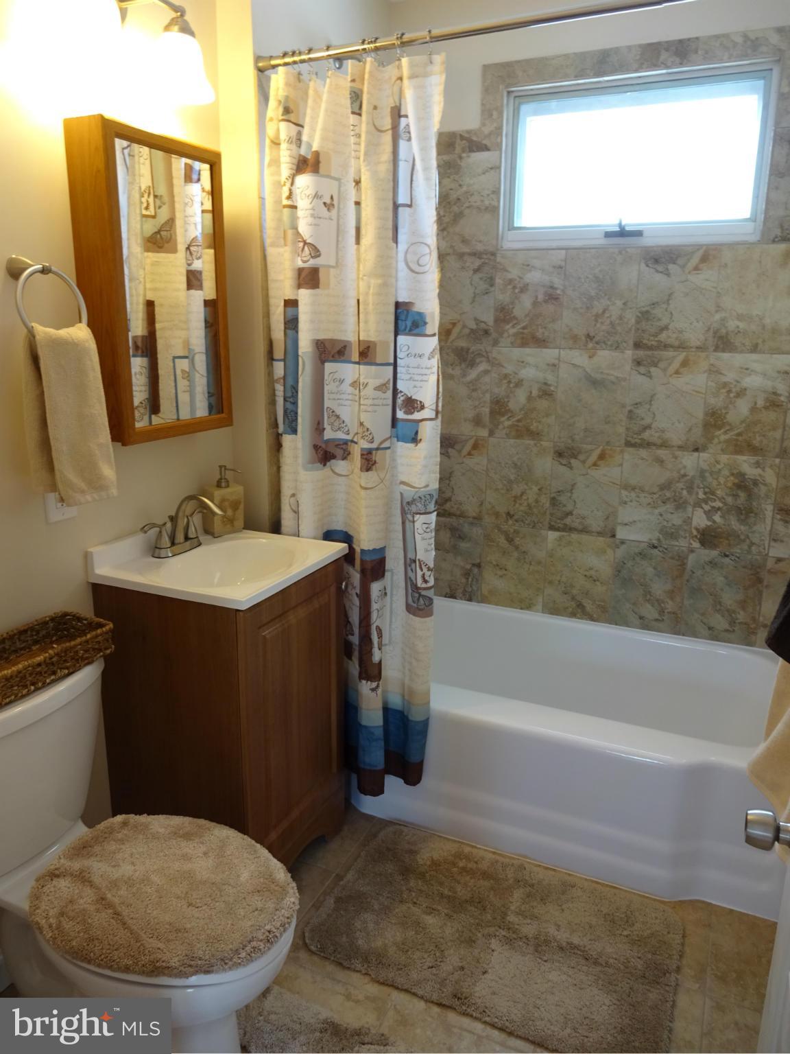 1614 Leslie Road Baltimore, MD 21222 - Photo 10 of 22 Updated Main Bath w/ Ceramic Tile