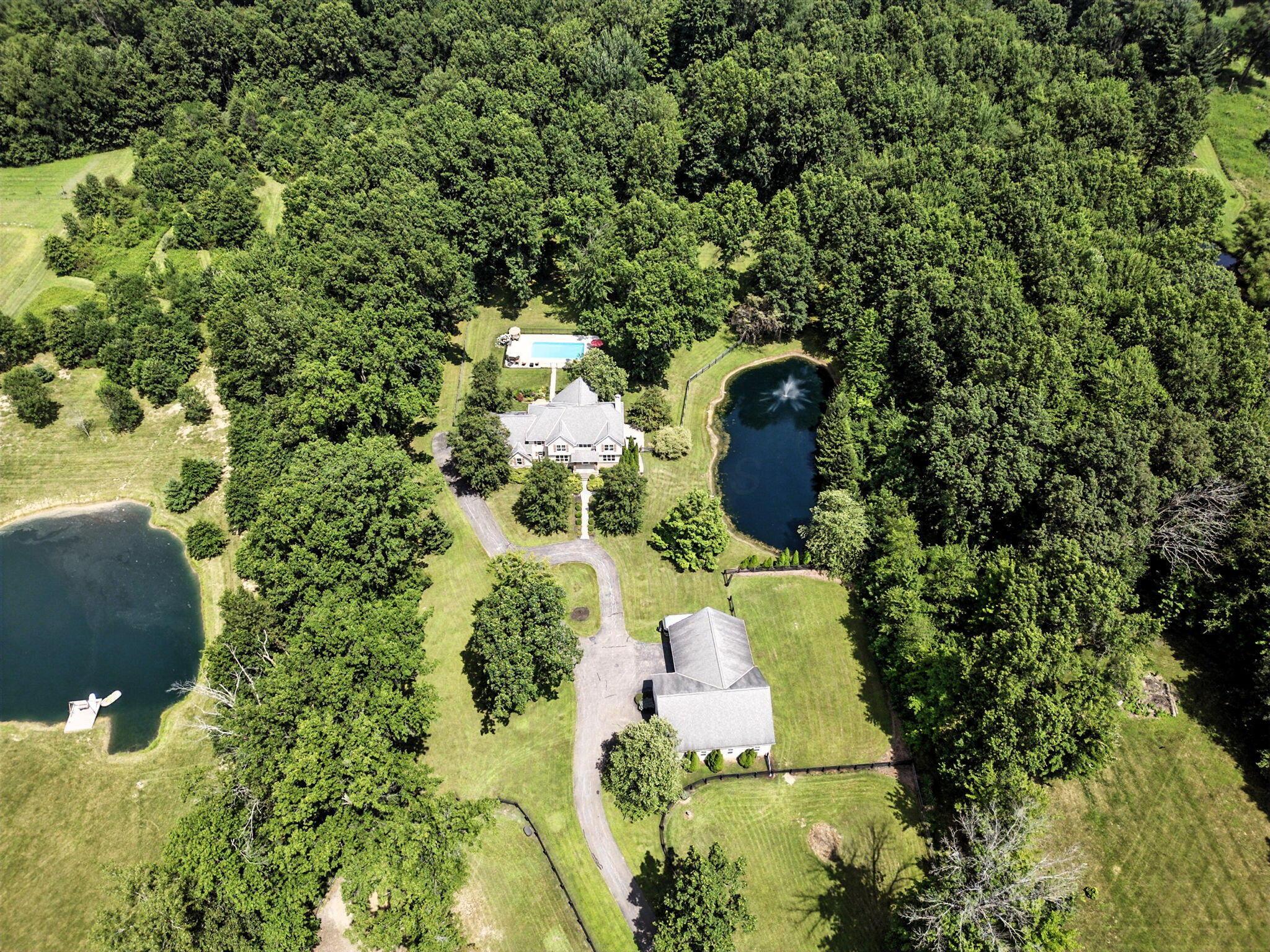 8174 Windy Hollow Road Johnstown, OH 43031 - Photo 2 of 76 Discover your own private oasis on this expansive 11.89-acre parcel.