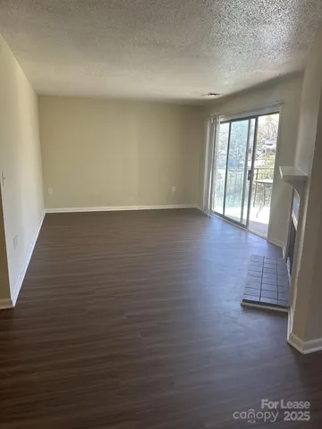 a view of a livingroom with wooden floor