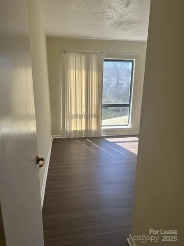 a view of a hallway with windows