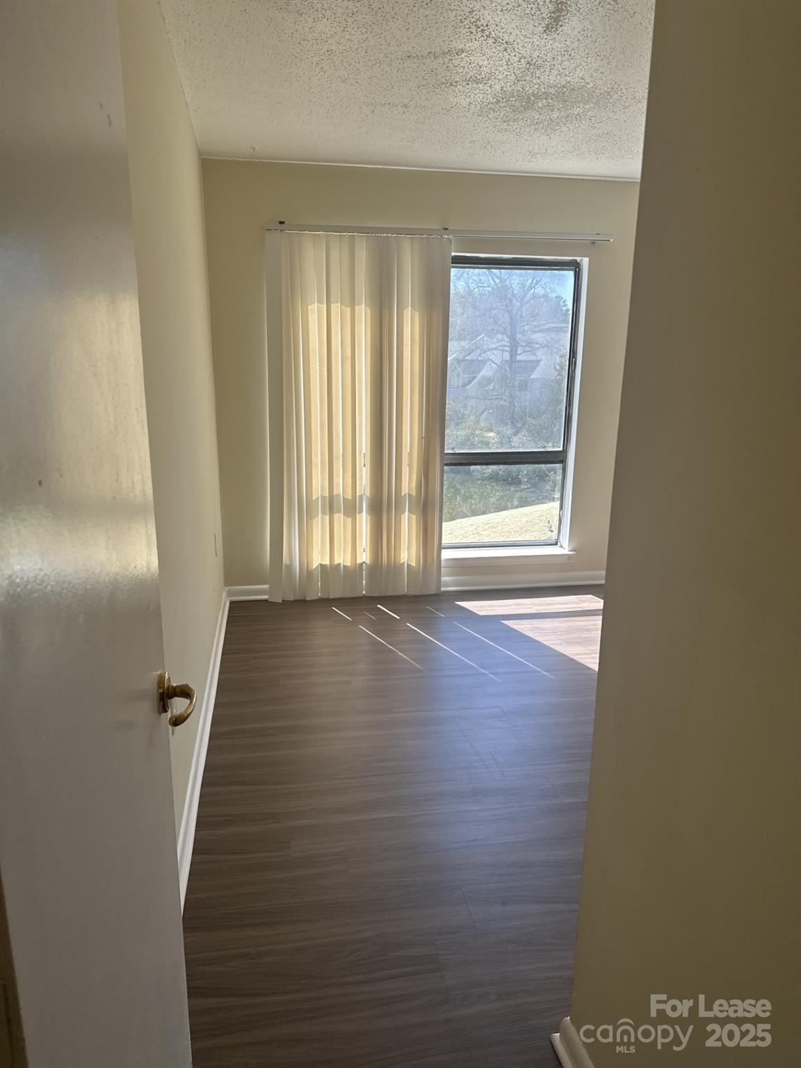 4816 Spring Lake Drive, Unit E Charlotte, NC 28212 - Photo 10 of 14 a view of a hallway with windows