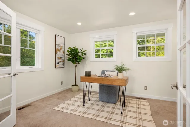 a workspace with furniture and window