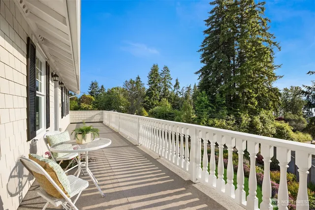 a view of a chairs and tables in the balcony