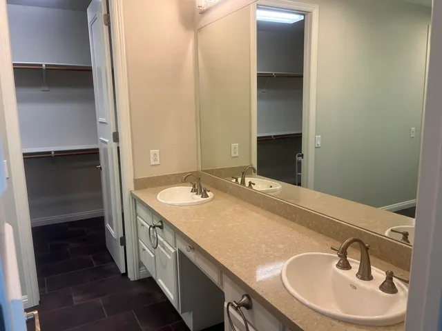 a bathroom with a bathtub and shower