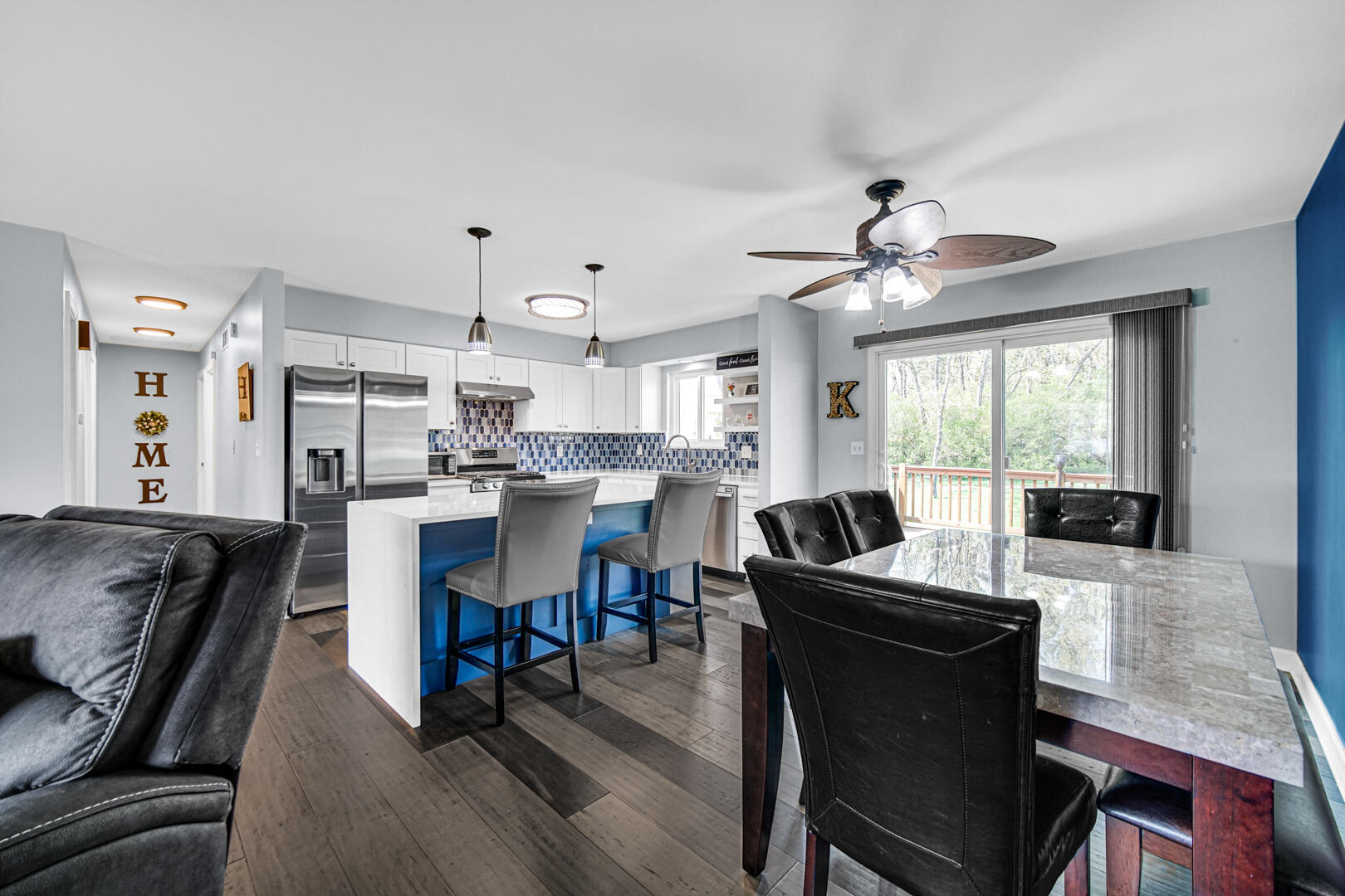 3113 Devonshire Circle Crown Point, IN 46307 - Photo 5 of 18 a kitchen with granite countertop a table chairs microwave and cabinets