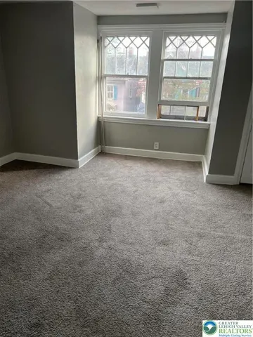 en empty room with windows