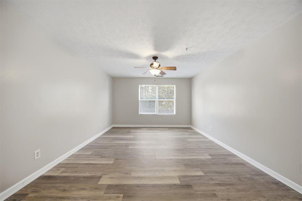 8201 Fairington Ridge Circle Lithonia, GA 30038 - Photo 3 of 9 a view of an empty room with a window
