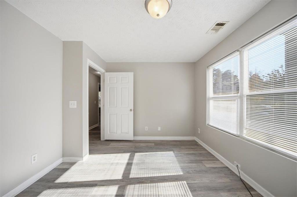 8201 Fairington Ridge Circle Lithonia, GA 30038 - Photo 6 of 9 a view of an empty room with a window