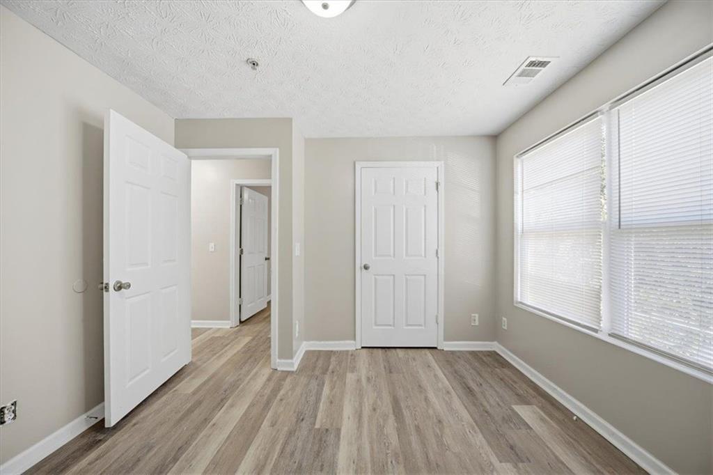8201 Fairington Ridge Circle Lithonia, GA 30038 - Photo 8 of 9 wooden floor in an empty room