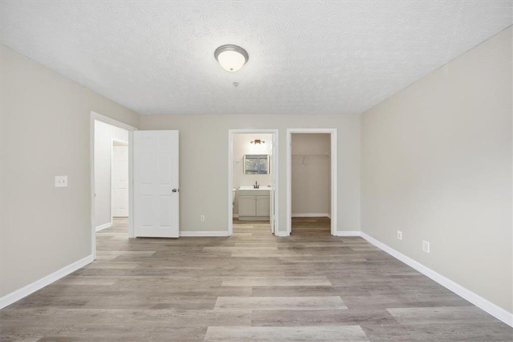 8201 Fairington Ridge Circle Lithonia, GA 30038 - Photo 9 of 9 a view of an empty room and window and wooden floor