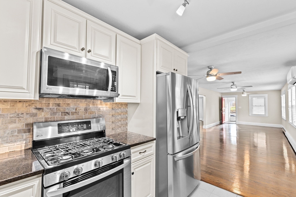 31 Crawford Road Braintree, MA 02184 - Photo 6 of 18 a kitchen with stainless steel appliances granite countertop a refrigerator stove top oven and sink