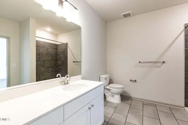 a bathroom with a sink and a toilet