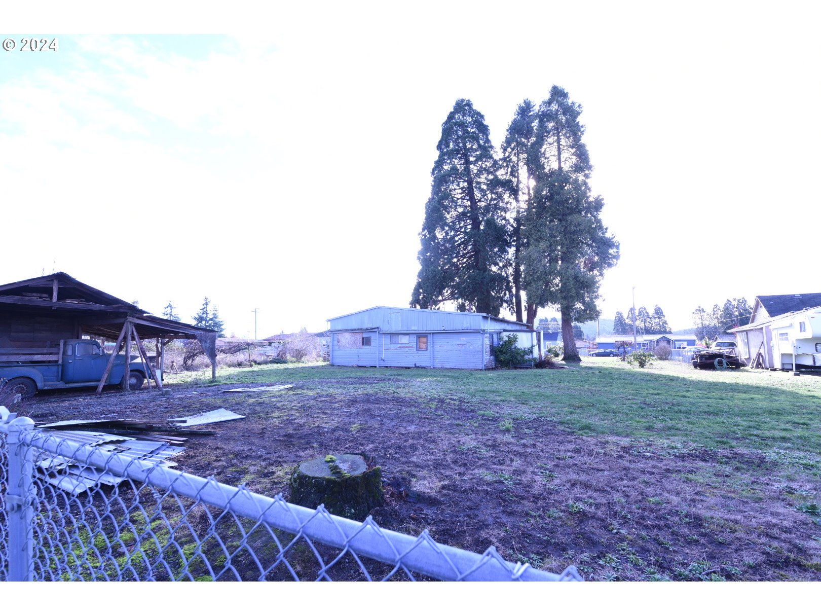 3720 Virginia Avenue Springfield, OR 97478 - Photo 6 of 6 a backyard of a house with lots of green space