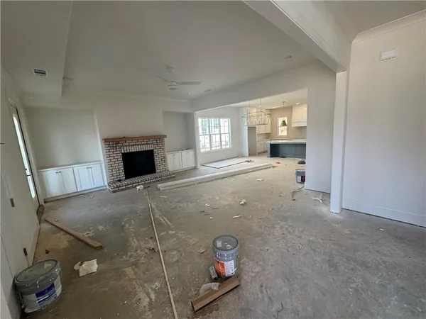 a view of empty room with a fireplace