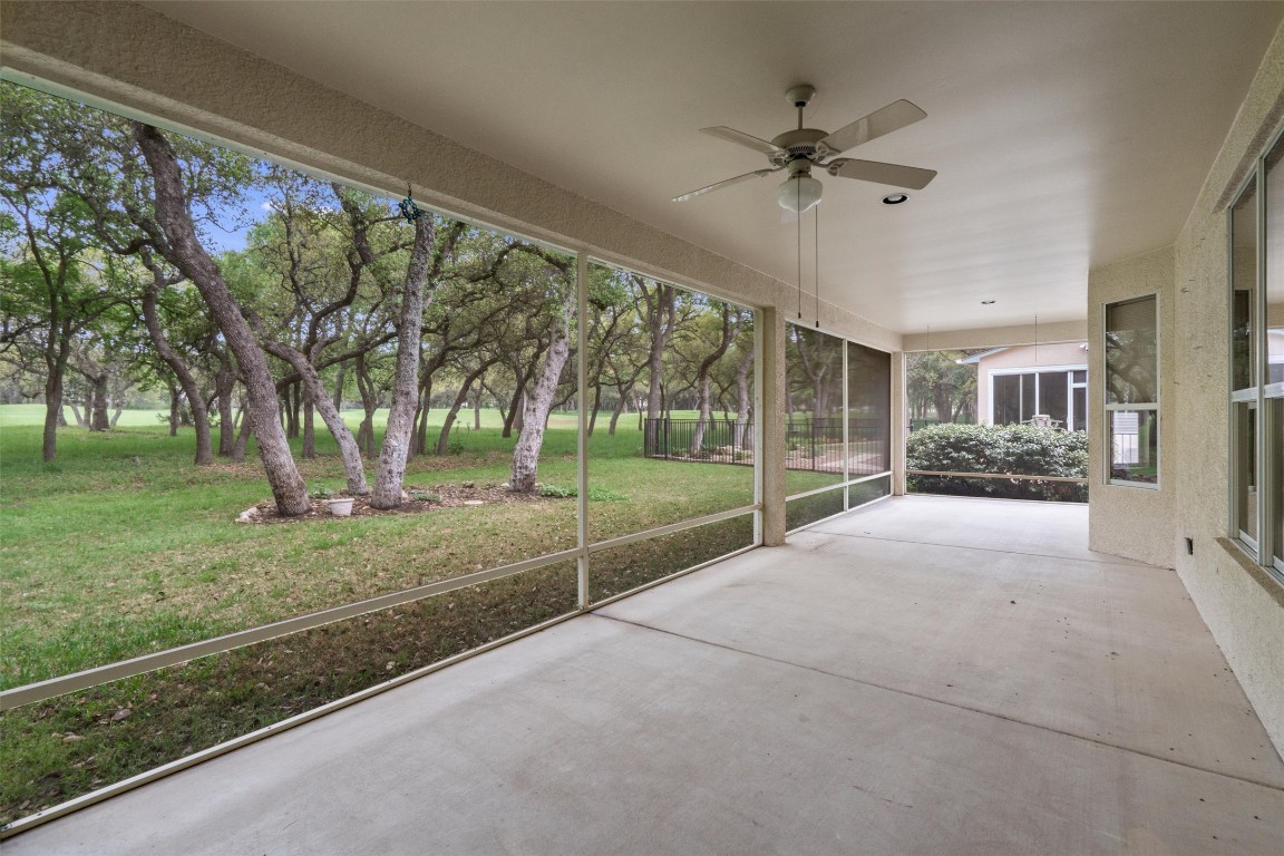 a view of a house with backyard and tree s
