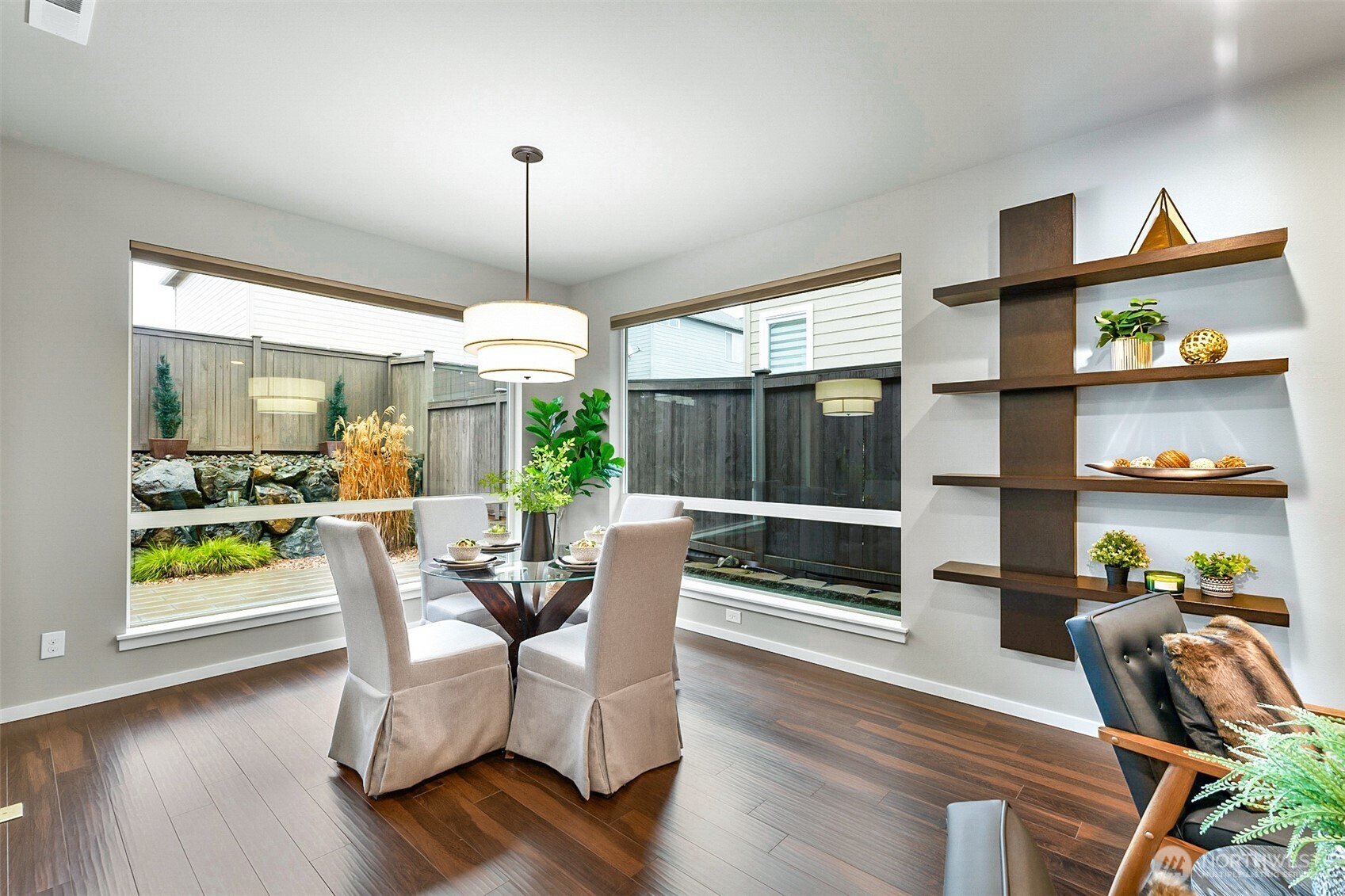 4009 168th Place Southeast Bothell, WA 98012 - Photo 12 of 38 a dining room with furniture one side view and wooden floor
