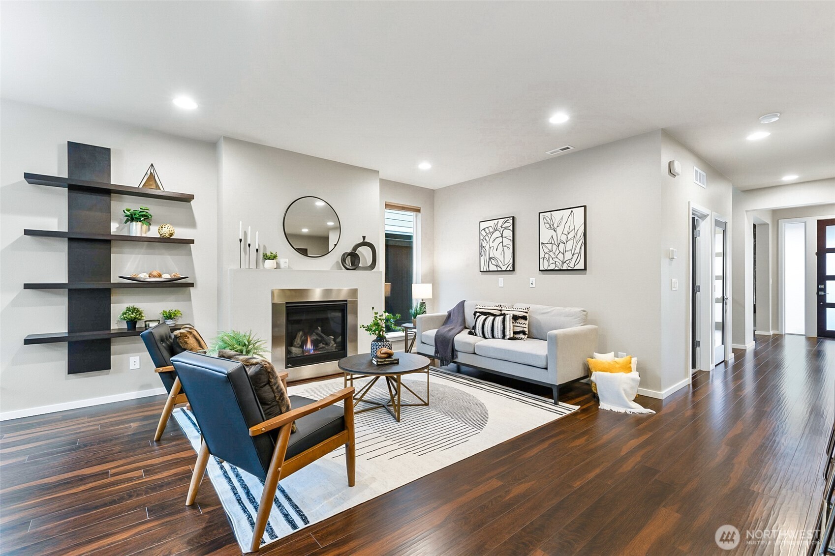 4009 168th Place Southeast Bothell, WA 98012 - Photo 15 of 38 a living room with furniture a fireplace and a wooden floor