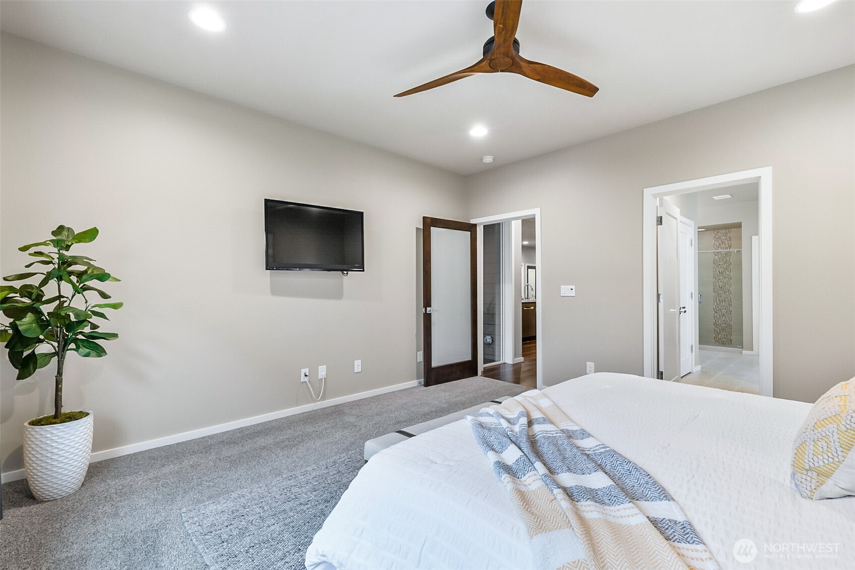 4009 168th Place Southeast Bothell, WA 98012 - Photo 22 of 38 a bedroom with a large bed and a chandelier