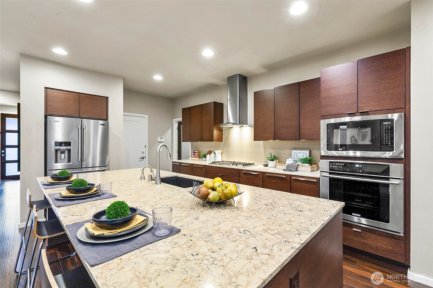 4009 168th Place Southeast Bothell, WA 98012 - Photo 10 of 38 a kitchen with stainless steel appliances kitchen island granite countertop a sink and stove